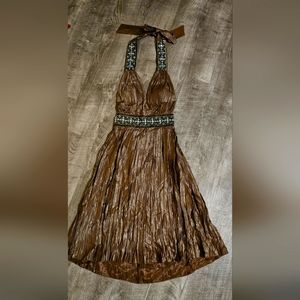 Lyndia Metallic Halter Dress with Bead Accent. Tie at neck. Bodice lined. Size 2